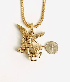 "18K GOLD PLATED SAINT MICHAEL NECKLACE . FOR GOOD LUCK,PROTECTION,HEALTH AND ANY KIND OF DIFFICULTY . 22\" LONG CURB LINK CHAIN. 4 MM PENDANT : 55x40mm 18K BANO DE ORO CADENA DE SAN MIGUEL . PARA PROTECCION,BUENA SUERTE,SALUD Y PARA CUALQUIER CASO DIFICIL. 22\" LARGO CADENA. DIJE: 55x40mm" Gold Charm Necklace With Figaro Chain In 14k Gold, Gold Pendant Jewelry With Figaro Chain, Rose Gold Figaro Chain Jewelry In Gold Plated, Rose Gold Plated Figaro Chain Jewelry, Rose Gold Plated Jewelry With Figaro Chain, Rose Gold-plated Jewelry With Figaro Chain, Gold-plated Jewelry With Figaro Chain, Gold-tone Cuban Link Jewelry, Tarnish Resistant Gold-tone Cuban Link Jewelry