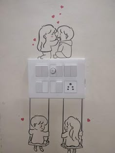 a drawing of two people kissing in front of a wall mounted light switch with hearts drawn on it