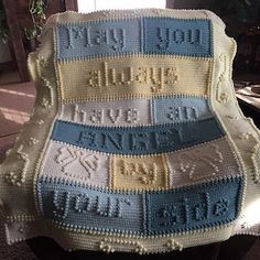 a crocheted blanket with words written on it