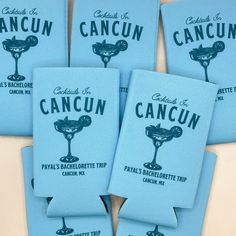 six blue napkins with the words cancun printed on them are stacked together