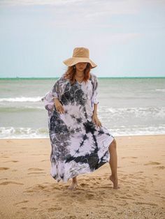 Add a touch of unique style to your wardrobe with our Hand-Dyed Kaftan Dress! This stunning dress is made from 100% breathable and comfy rayon fabric, ensuring maximum comfort all day long. Using our unique method, each dress is carefully hand-dyed, resulting in a one-of-a-kind masterpiece. The intricate patterns and vibrant colors make this dress a true work of art. Features and Fit * Fabric: 100% Breathable and Comfy Rayon * Method: Hand-Dyed for unique patterns and vibrant colors * Size: One Size Fits Most (M-3XL), accommodating various body types with ease * Bust Measurement: Up to 60", ensuring a flattering fit * Length: 55" * Width: 45" * Design: Trendy V-neck with side slits, slipover style for easy wear * Versatile and Stylish This kaftan dress is incredibly versatile and can be st Bohemian Tie Dye Beach Dress Cover-up, Tie Dye Beachwear Dress For Beach, Tie-dye Beach Dress For Beach Season, Tie Dye Beach Dress For Beach Season, Tie Dye Dress For Beach Season, Free Size Tie Dye Maxi Dress For Beach, Bohemian Tie Dye Beach Dress For Cover-up, Bohemian Tie Dye Beach Dress, Tie Dye Beach Dress For Festival