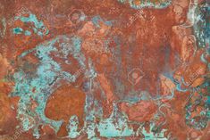 an old rusted metal surface with blue and red paint