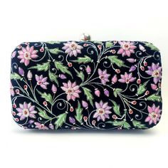 "Look your feminine best wearing this black velvet designer hard case clutch bag, embroidered with multicolored pastel flowers and embellished with genuine star ruby stones. This will be your go to purse for any wedding! A classic design that never goes out of style. Expertly hand embroidered by third generation zardozi artisans. The word Zardozi means \"gold thread\". It is an elaborate and intricate multidimensional embroidery using metallic threads and genuine semi precious stones. A centurie Wedding Clutch Purse, Embellished Purses, Designer Clutch Bags, Floral Handbags, Floral Clutches, Velvet Clutch, Wedding Purse, Wedding Clutch, Bridal Clutch