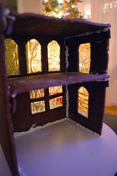 a close up of a doll house made out of paper