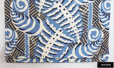 a blue and white pattern on fabric