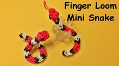 the finger loom mini snake is made with red, white and black yarn