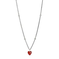 This is an authentic GUCCI Sterling Silver Enamel Interlocking G Heart Necklace Red. The necklace is crafted of sterling silver and features a red heart pendant on a polished chain with cutout G motifs throughout. Heart Necklace Red, Red Heart Pendant, Gucci Jewelry, Necklace Red, Silver Enamel, Red Heart, Heart Necklace, Sterling Silver Necklaces, Silver Necklaces