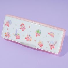 a pink and white business card case with little pigs on the front, sitting on a purple surface