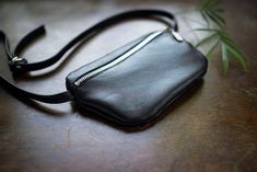 "Universal and elegant leather fanny pack. Holds whatever you may need it to hold, phone, coin purse, card holder, usb, a few keys, etc. Made of soft genuine black leather. Close with silver zip. Adjustable strap 12mm / 0.5\", length up to 95 cm/37,3\". If You want longer strap please write to me. Dimensions: h: 12 cm /4,7\" w: 20 cm/ 8\" Standard delivery time: European union: 4 - 10 days Europe (not EU): 7 - 14 days U.S.A., Canada: 10 - 20 days Australia, South America, Asia, India, North Afri Black Pouch Belt Bag As Gift, Hip Pouch, Structured Bag, Leather Fanny Pack, Festival Bag, Leather Belt Bag, Black Clutch, Black Leather Tote, European Union