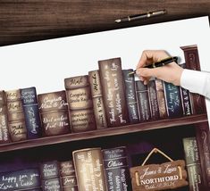 a person is writing on a book shelf