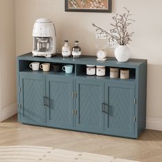 a blue cabinet with coffee mugs on it