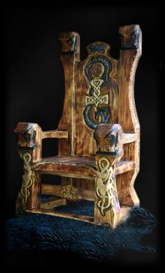 a carved wooden chair sitting on top of a blue carpeted floor next to a black wall