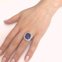 This ring is reminiscent of Princess Diana and Kate's royal cocktail engagement ring. Handcrafted cocktail ring holds a Ceylon cushion cut sapphire 12.28 ct center stone. It is surrounded by round white natural diamonds 3.20 ct. Diamonds are natural and white in G-H Color Clarity VS. Platinum 950 metal. Length: 1.5 cm Width: 1.9 cm Weight: 10.2 g [shortcode] [video] [/video] [/shortcode] Sapphire Engagement Ring Halo, Ceylon Sapphire Ring, Chanel Jewelry Earrings, Sapphire Cocktail Ring, Platinum Diamond Rings, Gold Cocktail Ring, Sapphire Engagement Ring Blue, Diamond Cocktail Rings, Sapphire Diamond Ring