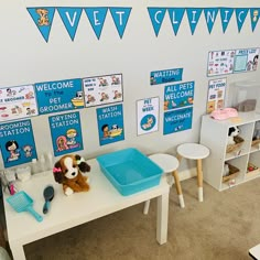 a child's playroom with toys and posters on the wall, including a stuffed animal