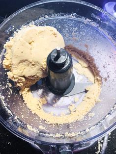 a food processor filled with flour and other ingredients