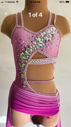 a mannequin wearing a pink and purple dress with sequins on it