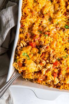 a casserole dish filled with pasta and meat