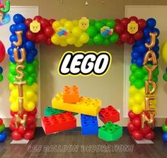 an arch made out of lego blocks and balloons with the word lego spelled on it