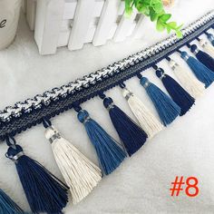 the blue and white tassels are lined up next to each other on the floor