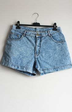 Vintage shorts*Acid wash denim shorts*Folded legs*Light blue wash*High waisted fit*For women*Excellent condition*Do not stretch, 100% cottonSize: W32 / MediumWaist: 32 1/4 inch / 82 cmHips: 44 inch / 112 cmRise: 11 3/4 inch / 30 cmInner leg: 3 1/2 inch / 9 cmOuter length:13 3/4 inch / 35 cmMaterial:98% Cotton2% ElastaneYou can also check other jeans from my shop:https://www.etsy.com/shop/sisuvintagestore?section_id=21302536--- SHIPPING ---Every parcel is shipped as registered priority.Shipping t Acid Wash Short Length Jeans, Acid Wash Cotton Short Jeans, High Waist Faded Washed Shorts, Acid Wash Short Cotton Jeans, Faded High Waist Washed Shorts, Acid Wash High Waist Denim Jean Shorts, High Waist Acid Wash Denim Jean Shorts, Acid Wash High Waist Denim Shorts, Acid Wash Cotton Jean Shorts