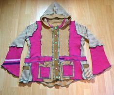 "\"rASPBERRY RIPPLe\" ice cream sweater jacket, upcycled from knits of accented pink, biscuit and wafer pattern, with candy pink and bubble gum blue buttons. Complete with four pockets, quadruple the choice to store your keys. UK size 16- 18 Chest 46 inches Shipping included in price. I have other prodigious prismatic knitwear, funky dresses and tops in my shop, so please have a browse. REFUNDS Important note about refunds. I no longer offer refunds outside of the UK due to customs charges incurred. Please check measurements and feel free to message if further measurements are needed. Thankyou." Bohemian Long Sleeve Patchwork Sweater, Casual Winter Festival Sweater, Bohemian Hand Knitted Sweater For Fall, Bohemian Knitted Winter Sweater, One Size Patchwork Sweater For Winter, One Size Long Sleeve Sweater For Festival, One Size Long Sleeve Festival Sweater, Bohemian Hand-knitted Wool Sweater, Bohemian Hand Knitted Wool Sweater