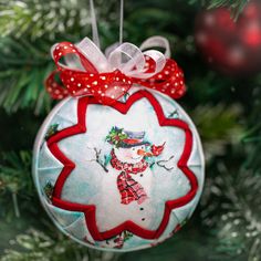 a christmas ornament hanging from a tree