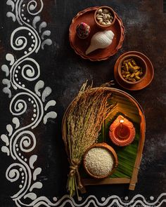 an overhead view of some food on a plate with rice and other foods in bowls