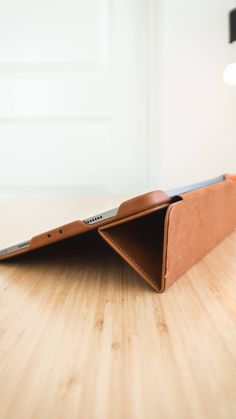 an ipad case sitting on top of a wooden table