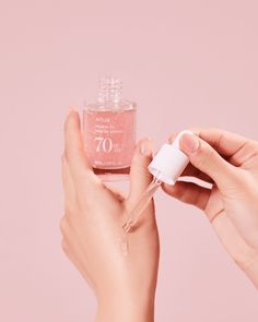 Formulated with a potent 5% concentration of Niacinamide, this serum effectively inhibits melanin pigment ensuring a more balanced complexion. Crafted with sensitivity in mind, this serum boasts 120 hours of low-temperature fermented peaches, preserving their niacinamide-rich properties while being gentle even on the most delicate skin types.The skin-nourishing effects of Vitamin B12, coupled with triple hyaluronic acid and pink yeast, deliver deep hydration and vitality to lackluster skin. Enha Fermented Peaches, Pink Skincare Products, Beauty Product Photography Ideas, Serum Photography, Skincare Advertising, Pink Serum, Skincare Organiser, Hydration Skincare, Packaging Skincare