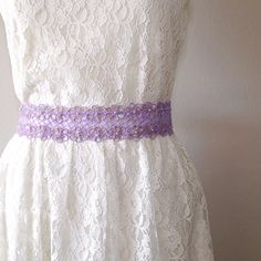 "Beautiful and lovely lavender color lace sash. Made of 2 1/4\" beaded embroidery lace with 1.5\" lavender color satin ribbon.Soft and warm looking sash good for your special occasions. Your beautiful item will ship in a lovelike gift box. If you want to change the color or have any questions, please feel free to contact me. Thanks:)  ♥ 2 1/4\" embroidery lace portion is 18\"  ♥ 1.5\" satin ribbon   ♥ Pearl beads / Iridescent color sequins  ♥ Adult sash 105\" / Flower girl sash 78\"    ♥ ♥ ♥ ♥ ♥ Adjustable Bridesmaid Bridal Belt With Sashes, Adjustable Bridal Belt With Sashes For Bridesmaid, Bridesmaid Sash, Iridescent Color, Wedding Sash Belt, Lovely Lavender, Wedding Sash, Wedding Belts, Bridal Belt