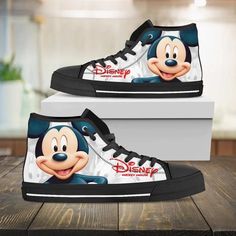 Mickey Mouse Disney High Top Shoes Urban High Tops High-top canvas shoes exude a unique blend of casual comfort and trendy fashion. These iconic shoes feature a high-rise design that wraps the ankle, providing exceptional support and style. Crafted from breathable and lightweight canvas material, they offer comfort and flexibility for everyday wear. Their versatile nature effortlessly transitions from laid-back outings to trendy urban styles, allowing for easy pairing with various outfits. The l Sporty High-top Sneakers With Character Print, Casual Mickey Mouse Lace-up Sneakers, Disney Mickey Mouse Low-top Sneakers, Casual Low-top Sneakers With Character Print, Disney Low-top Sneakers With Rubber Sole, Mickey Mouse Synthetic Sneakers For Streetwear, Black Mickey Mouse Sneakers For Streetwear, Disney Low-top Sneakers For Streetwear, Disney Character Print Sneakers With Round Toe