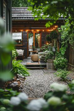 a small wooden house with lights on the porch