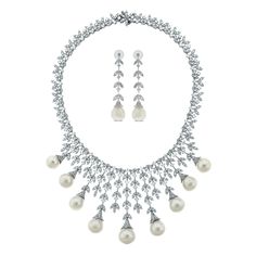 A timeless classic, the Diamond & Pearl Vines Necklace & Earrings Suite is a fine balance of elegance and flamboyance.  Gemstones Type: Pearl Gemstone Origin: South Sea  Gemstones Shape: Drop Shape Gemstones Weight: 136.80 ct (Necklace) & 33.12 ct (Earrings) Gemstones Color: White  Diamonds Shape: Round Tot South Sea Pearl Necklace, Earrings Diamonds, Gold For Sale, Pearl Necklace Earrings, Pearls Necklace, Diamond Free, Antique Necklace, Wedding Ring Designs, Vintage Necklaces