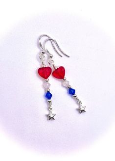 * Express your love for our country this 4th of July and/or Memorial Day and for those who devote and have sacrificed their lives for our freedom in the USA by wearing red, white, and blue. What cuter way to wear all 3 colors than this fun and pretty pair of sterling silver and Red Heart, White, and Blue Swarovski Crystal earrings with little Sterling Silver Puffed Stars at the bottom of the dangles. * Perfect for many occasions such as Memorial Day, Independence Day, July 4th, a Valentines Day Patriotic Earrings For 4th Of July, Patriotic 4th Of July Earrings, Patriotic Drop Earrings For 4th Of July, Patriotic Nickel-free Jewelry For 4th Of July, Patriotic Dangle Earrings For Independence Day, Patriotic Dangle Jewelry For Independence Day, Patriotic Earrings For 4th Of July Gift, Patriotic Silver Dangle Earrings, Patriotic Dangle Jewelry For Gifts