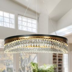 a chandelier hanging from the ceiling in a dining room