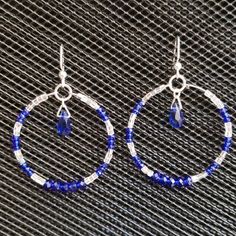 Hoop Earrings Sparkle With Royal Blue Rondelle Crystals And Silvery-Clear Faceted Half-Bugle Beads. A Royal Blue Teardrop Crystal Dangles In The Middle. Hoops Are 1 3/4"/4cm In Diameter And Hang 2 1/4"6cm From The Ear Wire. Brand New, Never Worn Nwot. Handmade By Me, The Sparkliefiend! Part Of 3-For-$20 Deal! Blue Hoop Earrings With Ear Wire, Blue Hypoallergenic Hoop Jewelry, Blue Hypoallergenic Small Hoop Jewelry, Hypoallergenic Blue Small Hoop Jewelry, Hypoallergenic Blue Hoop Jewelry, Blue Metal Hoop Earrings, Blue Small Hoop Earrings With Matching Set, Blue Small Hoop Earrings For Pierced Ears, Nickel-free Blue Metal Hoop Earrings