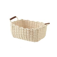 a white basket with brown handles on a white background