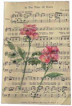 an old sheet with flowers on it and music sheets in the background, as well as words