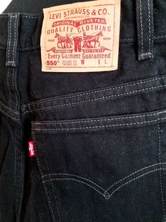 Pristine vintage Levi's 550 jeans from the 1990s. Medium-weight denim fabric (no stretch) in an inky black wash. High-waist, relaxed tapered leg fit. Classic five-pocket design with belt loops and zipper fly. No major flaws - excellent vintage condition! Measurements (taken flat): -Waist: 15 inches -Hip: 22 inches -Inseam: 33 inches No returns or exchanges. Please read the description and measurements carefully. Contact the seller directly with any issues. Black Retro Jeans For Fall, Retro Black Straight Leg Bottoms, 90s Style Dark Wash Cotton Pants, Vintage Tapered Leg Jeans For Fall, Retro Black Cotton Bottoms, Vintage Black Bottoms With Relaxed Fit, Black Vintage Bottoms With Relaxed Fit, Retro Washed Black Straight Leg Bottoms, Vintage Wide Leg Black Jeans