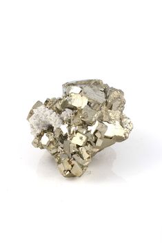 Pyrite is an iron sulfide mineral. Its crystal patterns are cubic, pyritohedral, or octahedral. The name pyrite is derived from the Greek word for fire. Pyrite’s shiny metallic appearance has earned it the nickname “fool’s gold.” The ancient Incas used Pyrite as mirrors. It is found all over the world, but important deposits are in Italy, Spain, and Peru. Pyrite is said to enhance willpower, helping one to overcome bad habits. Look closely, this beautiful one of a kind specimen from Peru has nat Pyrite Stone, Fool’s Gold, Crystal Pattern, Pyrite Crystal, Greek Words, Rocks And Gems, Hand Jewelry, Bad Habits, Thigh Tattoo