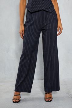 Wide-leg pinstripe trousers with front pleats 
 High-waisted fit with belt loops 
 Side pockets and smooth, structured fabric 
These versatile wide-leg trousers from Misspap are an essential addition to your casual wardrobe. Crafted from a polyester-viscose blend with elastane for stretch, the fabric has a smooth, structured drape. The high-waisted fit creates a flattering silhouette, while the front pleats and wide, straight legs emanate an effortlessly chic vibe. Style these pinstripe trousers with a sleeveless top and heeled sandals for a polished daytime look. Their relaxed fit also allows them to be dressed down - pair them with a casual camisole and trainers for laidback weekend wear. Their versatility enables easy transition from day to night. Casual Camisole, Pinstripe Trousers, Structured Fabric, Country Concert Outfit, Weekend Wear, Tailored Trousers, Sweater And Shorts, Night Outfits, Fashion Face