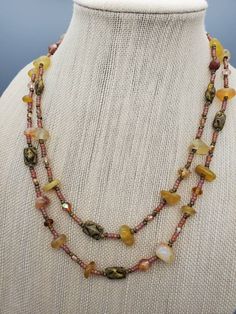 This beautiful long necklace is designed with honey yellow Agate beads, Czech glass beads, and seed beads in frosted rainbow amethyst and Picasso beige. The necklace is finished with silver plated lobster claw clasp. The length of the necklace is 44.0 inches. This necklace can be worn as a single long strand or it can be wrapped around twice for double strand layering necklace.  The matching dangle earrings are about 1.5 inches long. Seed Beads Necklace, Purple Set, Yellow Agate, Honey Yellow, Beaded Necklace Diy, Amethyst Purple, Seed Bead Necklace, Layering Necklace, Necklace And Earrings