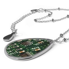 "Flip Technology Inside Out with Our Circuitboard Necklace!  Are you tired of conforming to societal norms and want to embrace your rebellious side? Our Circuitboard Necklace is here to help you do just that! This necklace is not your average piece of jewelry - it's a bold statement that challenges the status quo. The unique ellipse-shaped pendant is made with aluminum and designed to resemble an actual PCB*, flipping technology inside out and showcasing its raw beauty. The brass chain and pendant are built to last and offer a dazzling appearance that's sure to catch everyone's attention. But that's not all - our Circuitboard Necklace also features a lobster clasp closure that ensures a secure fit for all-day wear. You can now show off your rebellious side without worrying about losing you Cheap Adjustable Fandom Jewelry, Science Inspired Jewelry, Mother Board Computer Jewelry, Edforce Jewelry, Pcb Jewelry, Tech Necklace, Coder Girl, Girl Geek, Societal Norms