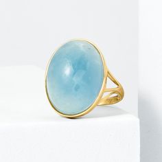 Ross-Simons - 25.00 Carat Aquamarine Ring in 14kt Yellow Gold. Size 10. With a sense of minimalistic style, this 25.00 carat oval aquamarine cabochon ring offers a timeless look with enduring appeal and an ethereal translucence. Set in polished 14kt yellow gold. 7/8" wide. Aquamarine ring. Aquamarine birthstones are the perfect gift for March birthdays. Modern Oval Cabochon Moonstone Ring For Formal Occasions, Modern Yellow Gold Oval Moonstone Ring, Modern Oval Moonstone Ring For Formal Occasions, Modern Oval Yellow Gold Moonstone Ring, Modern Oval Moonstone Ring In Yellow Gold, Formal Oval Cabochon Topaz Ring, Modern Oval Topaz Ring For Formal Occasions, Modern 14k Gold Oval Topaz Ring, Modern Blue Topaz Oval Ring