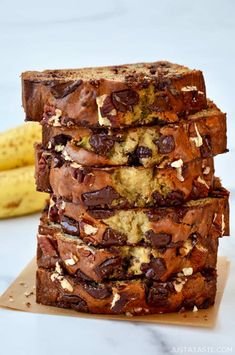 three pieces of bread stacked on top of each other with chocolate chips and almonds