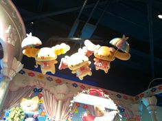 some stuffed animals hanging from the ceiling in a room