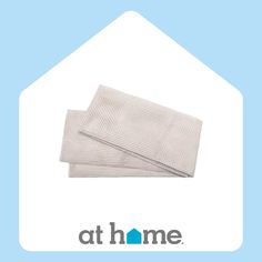 two pieces of cloth sitting next to each other on top of a blue and white background