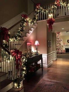 the stairs are decorated with christmas lights and garlands