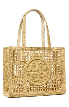 a straw bag with the letter s on it's front and side handles in gold