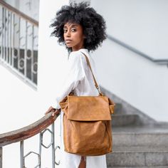 "100% Handmade Gorgeous and practical Honey Brown leather backpack / shoulder bag in a unique geometric cut with asymmetric details . This bag has a minimalistic and timeless form which makes it functional as a tote as well as backpack. It is made for a long day out of the house as well as a night out where you can carry your essentials plus laptop, a sweater, sunglasses etc... Fully lined with black strong cotton fabric which I divide to two large interior (one for laptop), large zip pocket, an Women Laptop Backpack, Backpack Purse Leather, Leather Backpack Women, Small Leather Backpack, Handmade Leather Backpack, Laptop Backpack Women, Small Leather Purse, Large Leather Bag, Leather Laptop Backpack